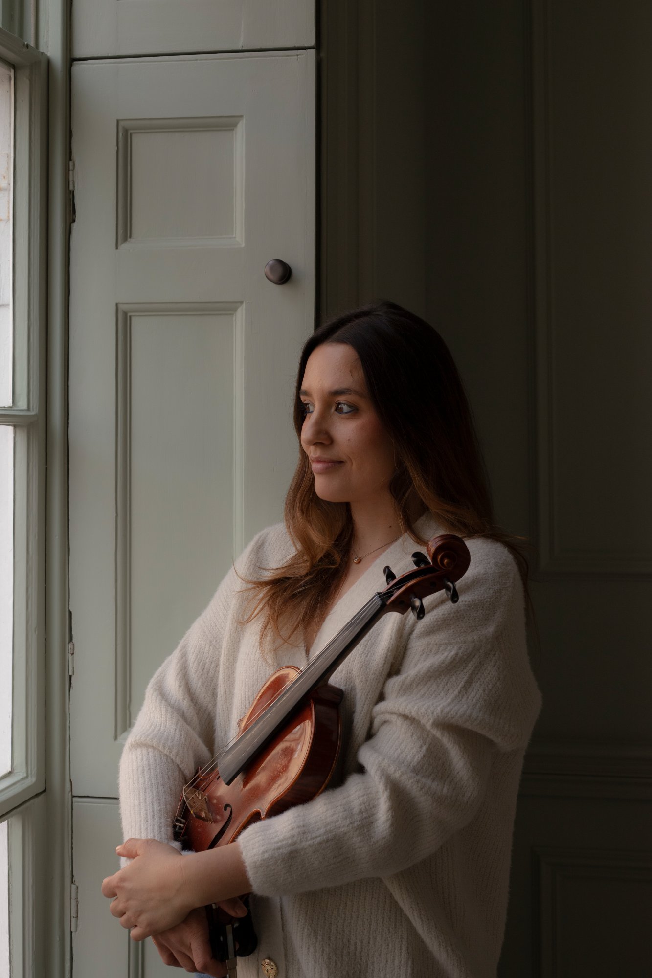 Ana Lima teaching piano to a student